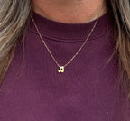 Stainless steel ketting met gouden muzieknoot.